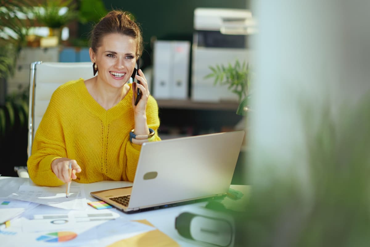 A small business owner working confidently on a laptop