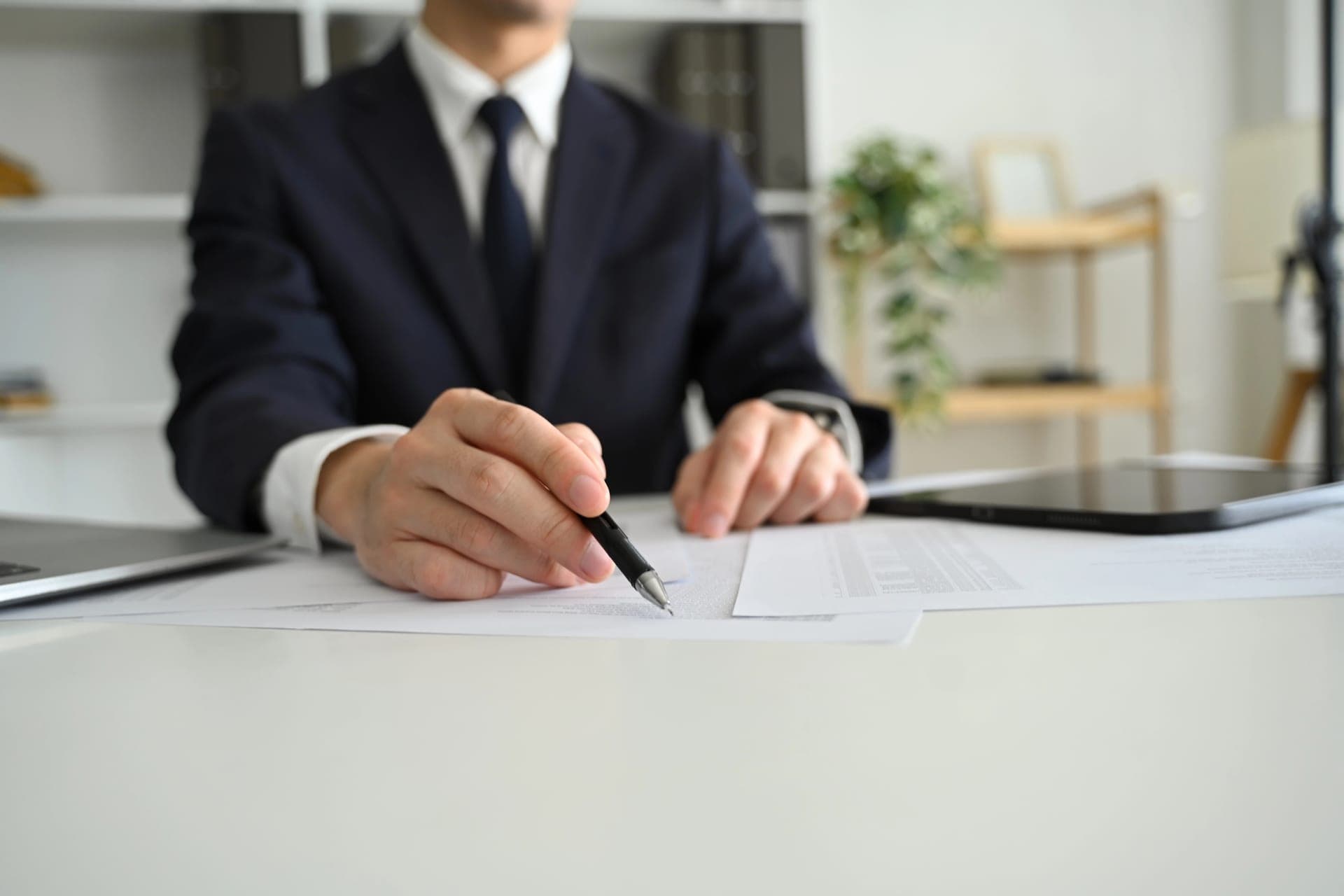 Reviewing a contract and inspection report at a desk