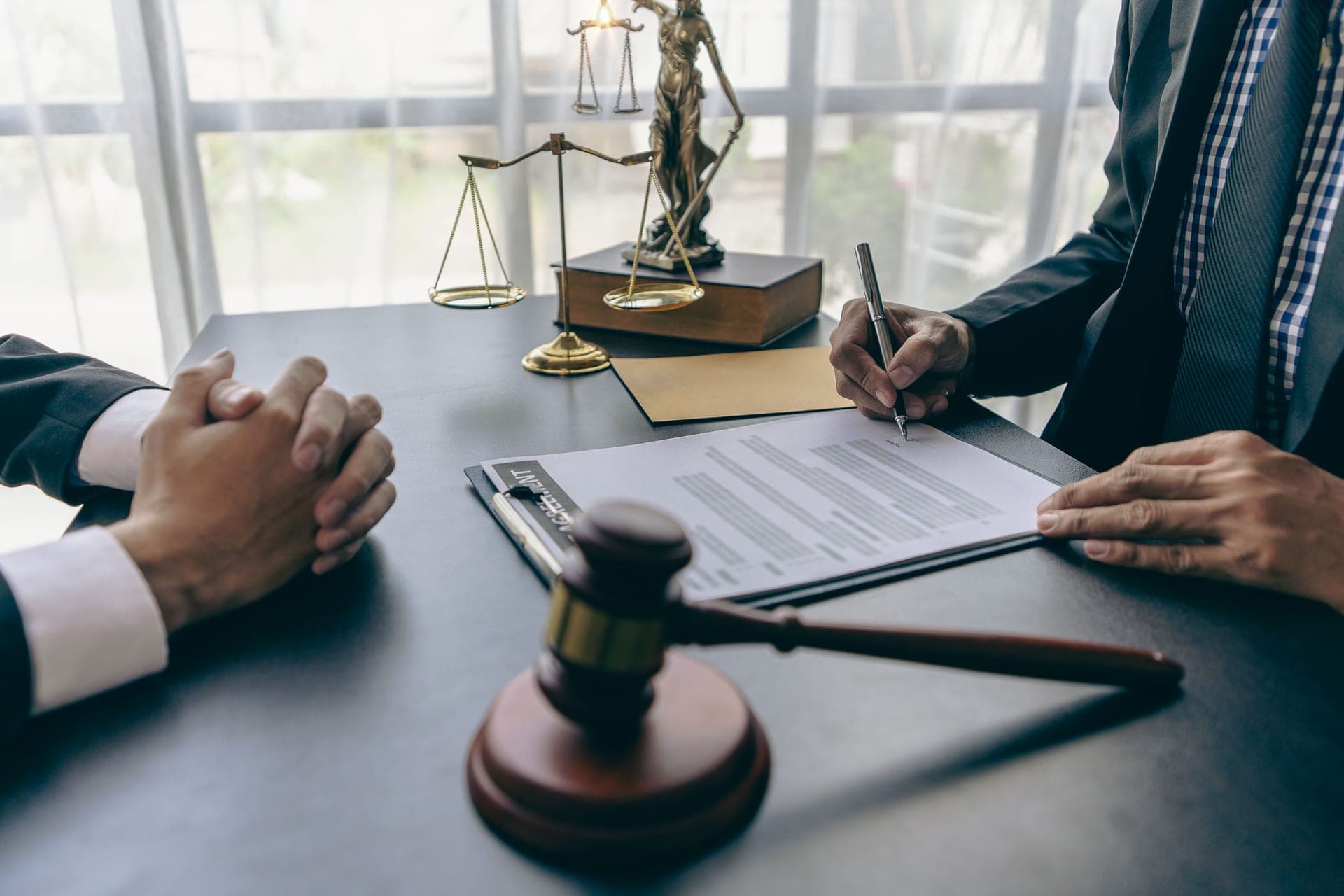 A business owner reviewing contract documents with an advisor